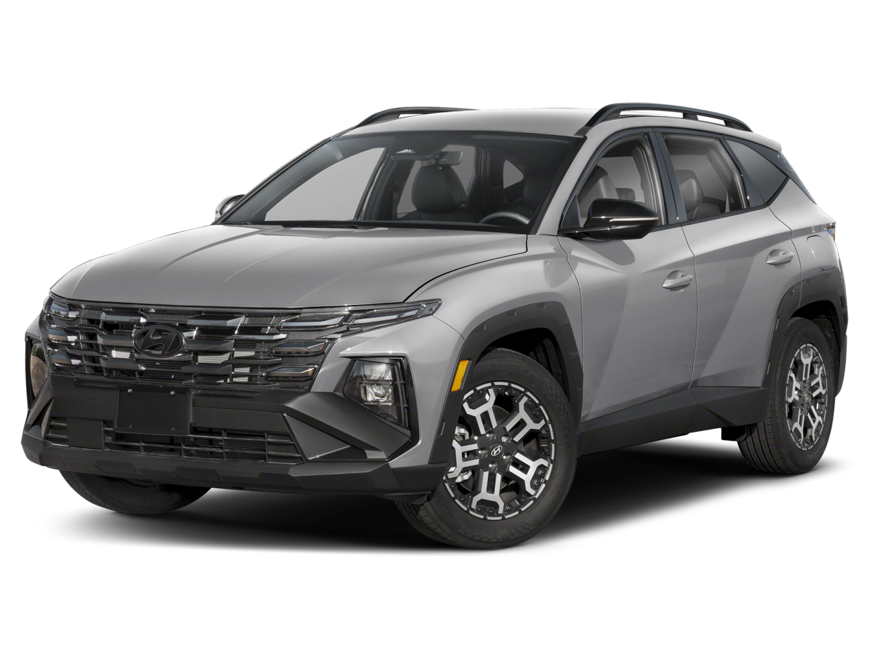 2026 Hyundai TUCSON XRT in White Pearl — front three-quarter view