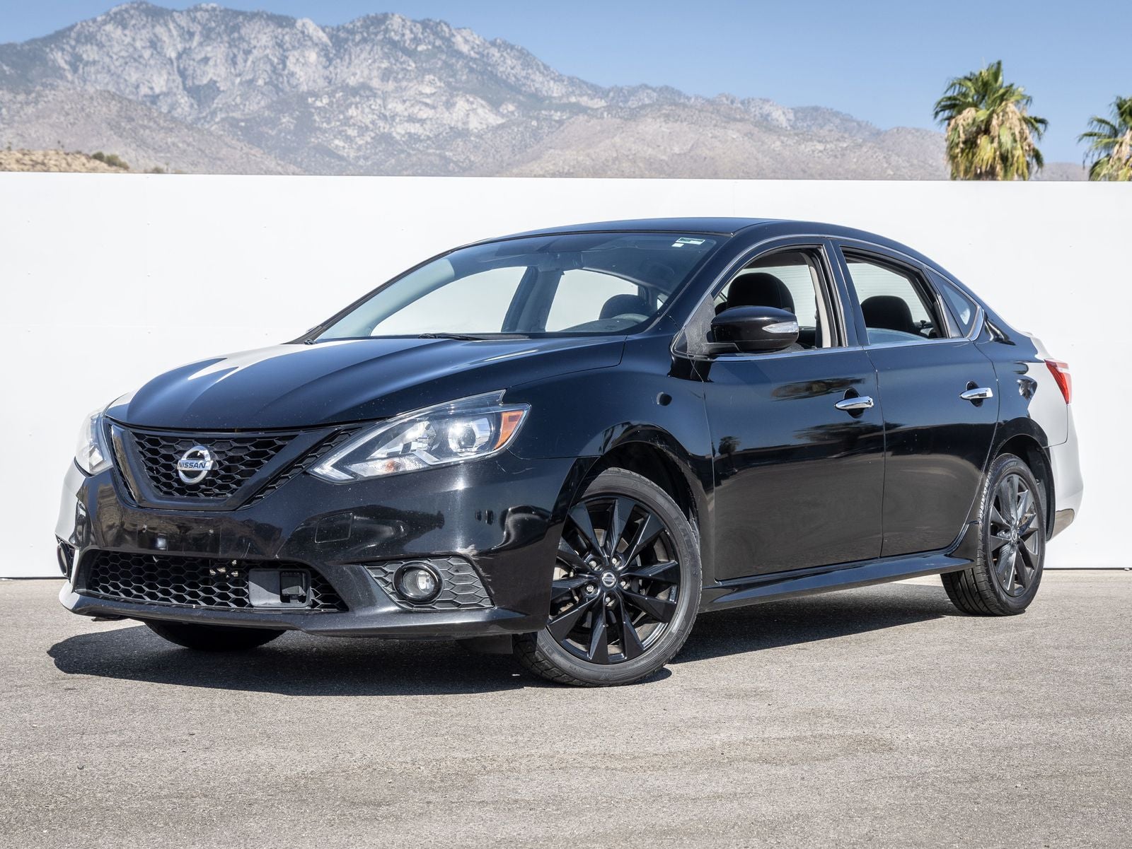 2018 Nissan Sentra SR in Super Black — front three-quarter view