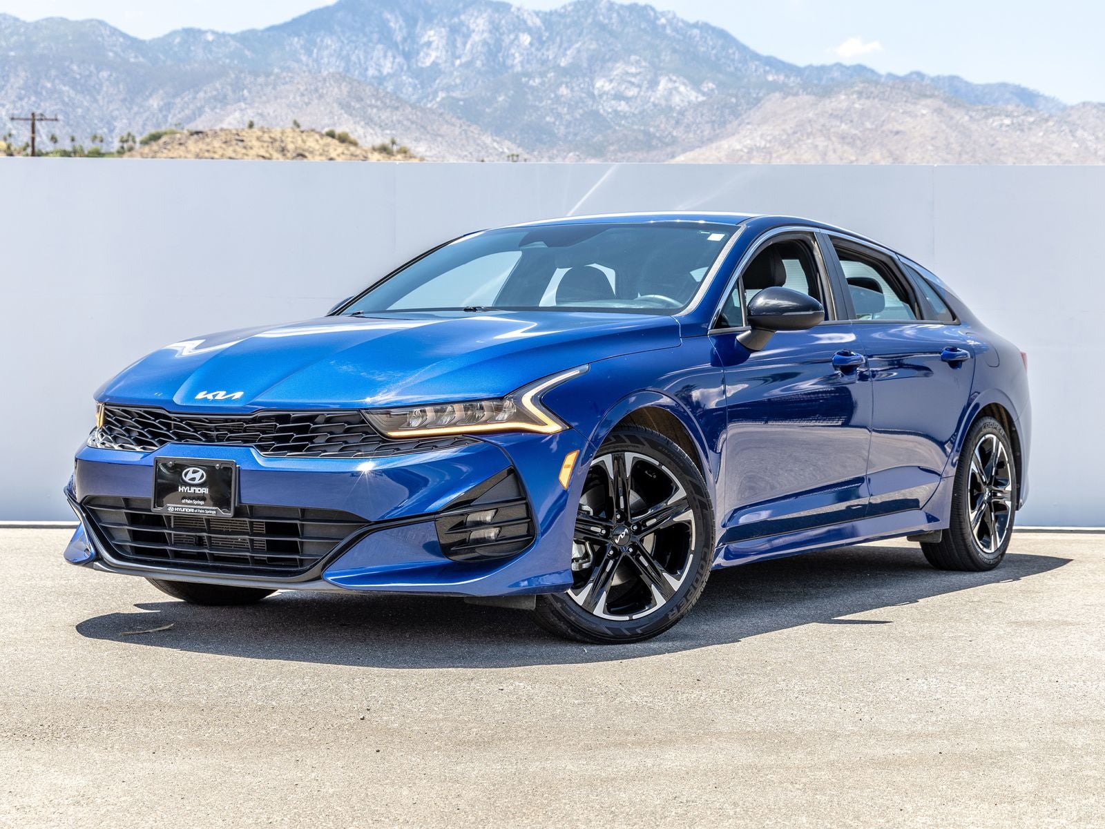 2022 Kia K5 GT-Line in Sapphire Blue — front three-quarter view