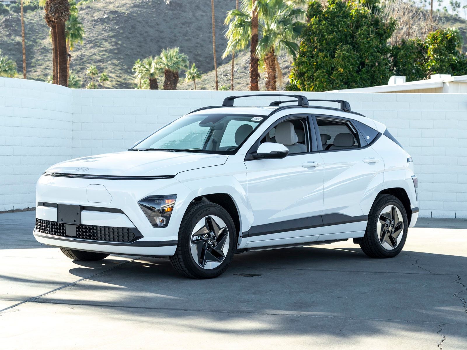 2025 Hyundai KONA ELECTRIC SEL in Atlas White — front three-quarter view